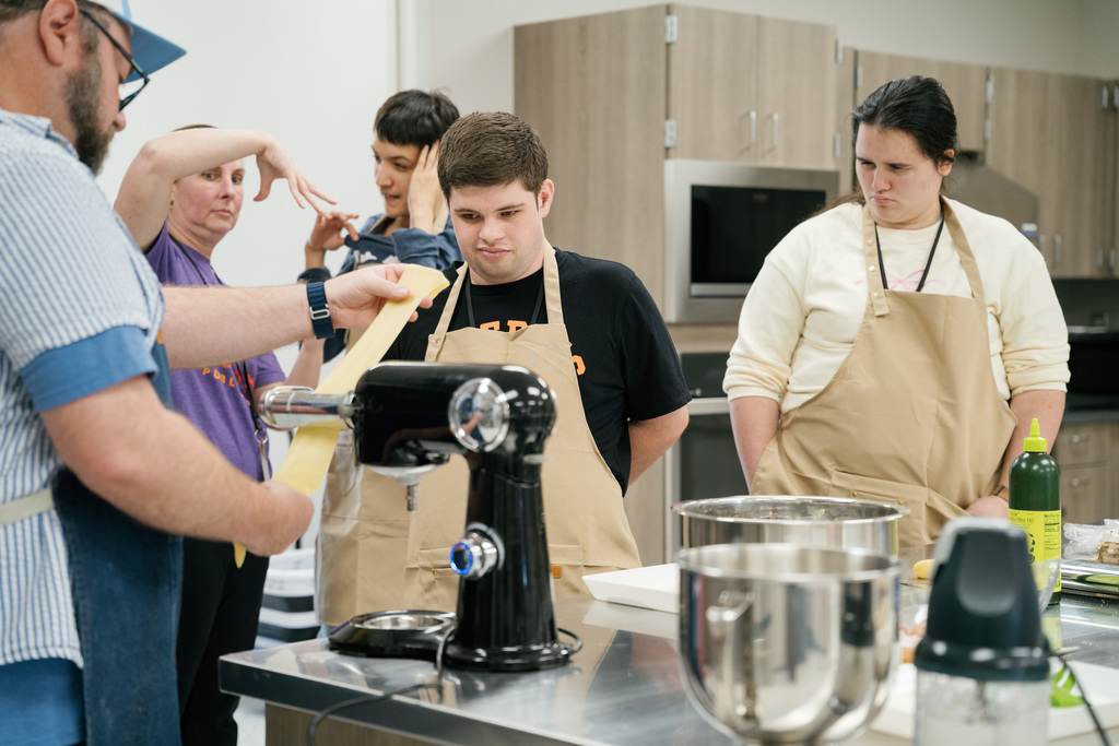 Students learning how to make homemade pasta