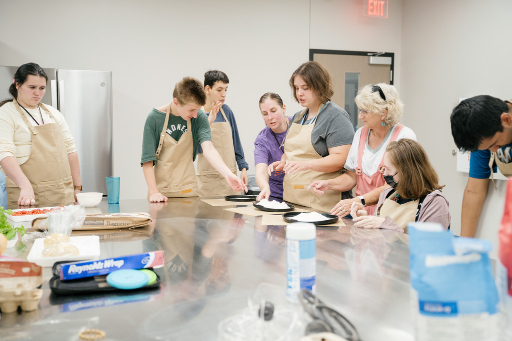 Students learning how to make pasta