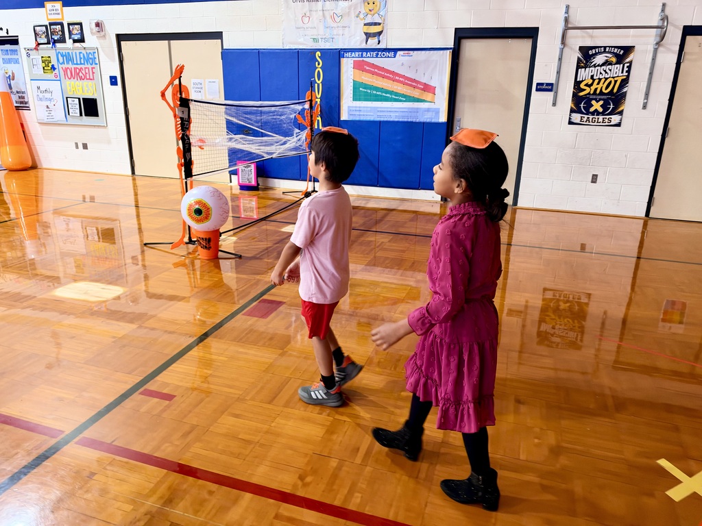 students walking balancing a bag on their head
