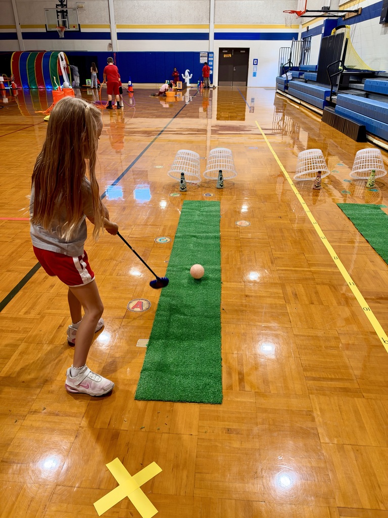 students playing themed mini golf 