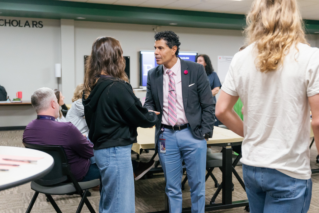superintendent shaking a students hand