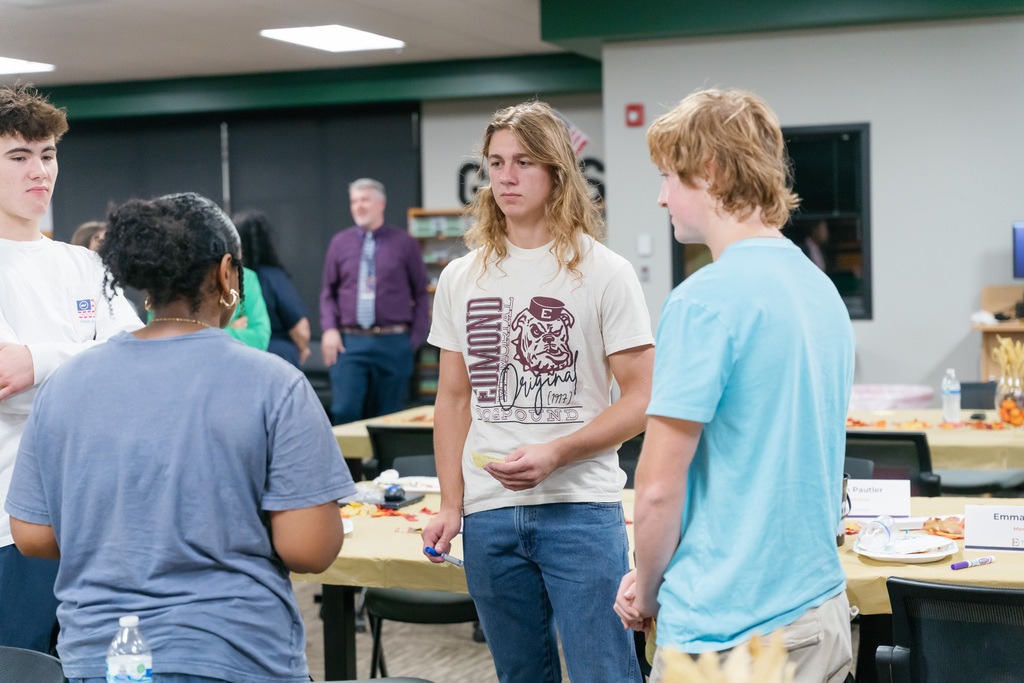 students talking in a circle