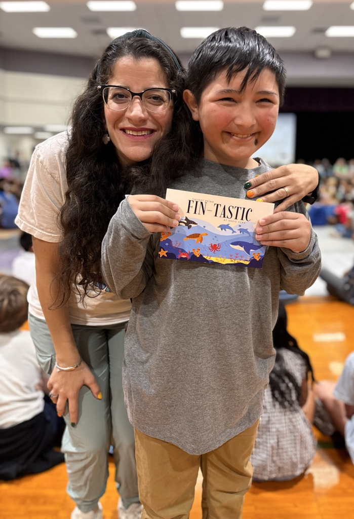 student and teacher with postcard 