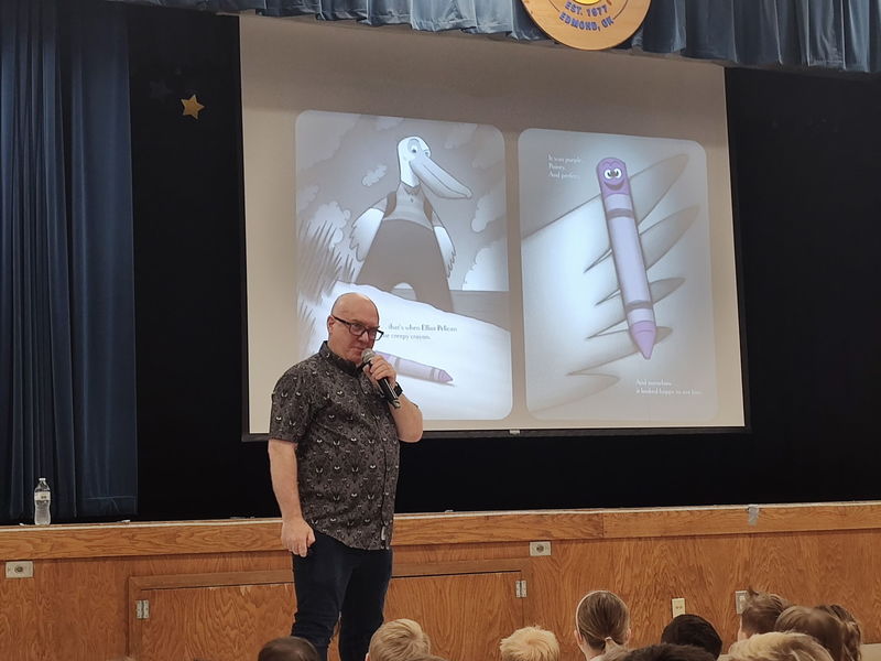 author speaking to students