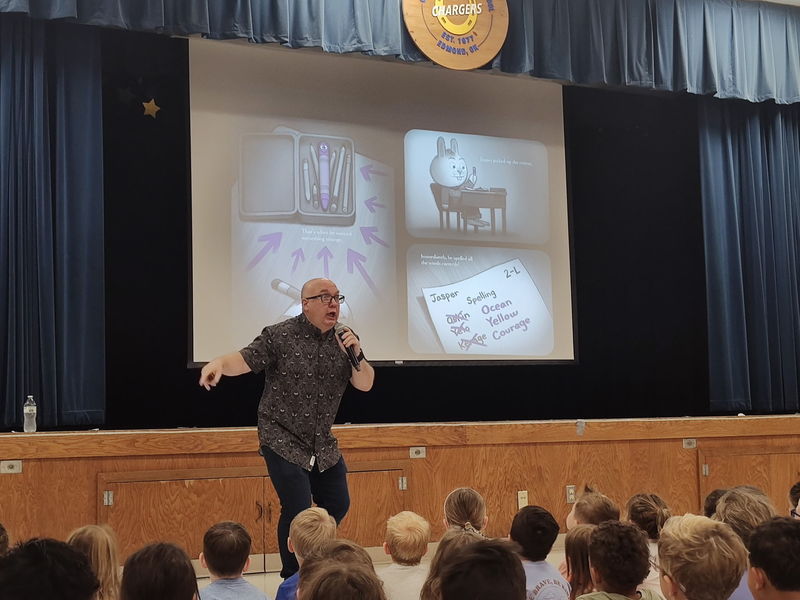 author speaking to students