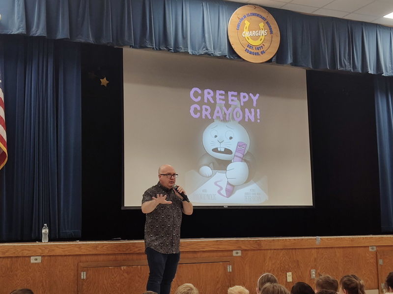 author speaking to students