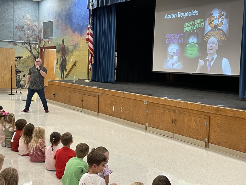author speaking to students
