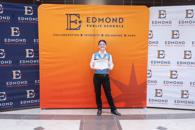 award winners holding their awards