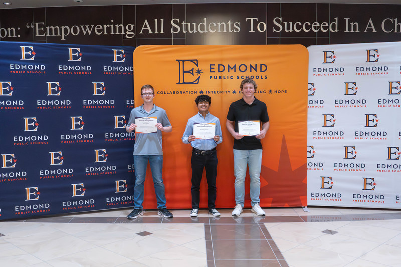 award winners holding their awards
