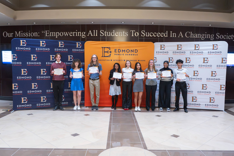 award winners holding their awards