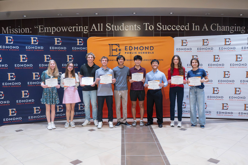 award winners holding their awards