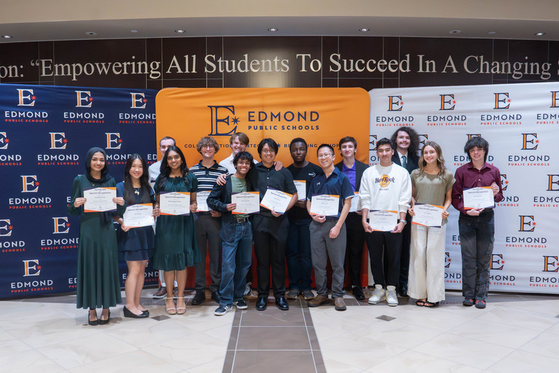 award winners holding their awards