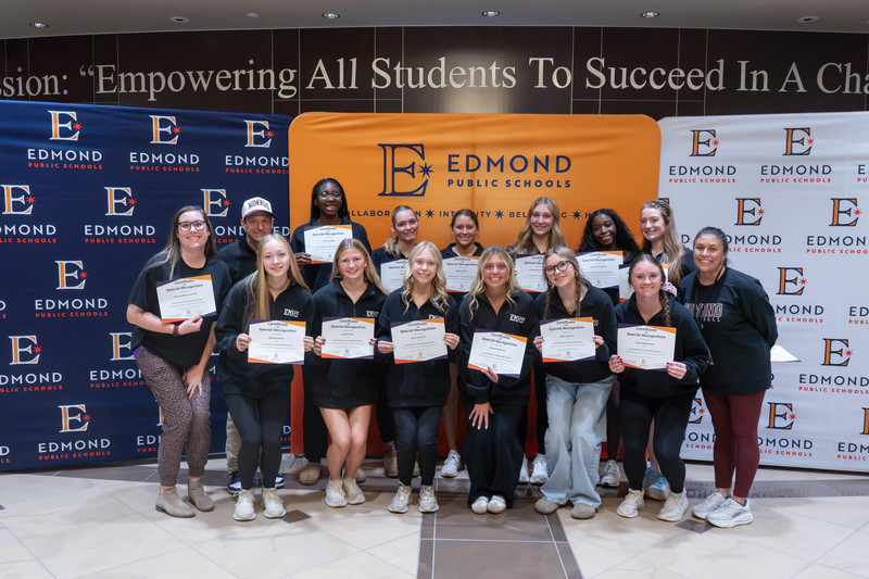 award winners holding their awards