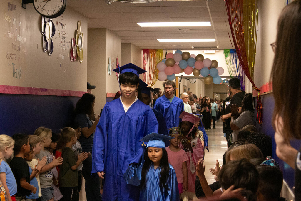 A mix of emotions filled the halls this morning as our graduating seniors took one final walk through the elementary campus — this time alongside our graduating kindergarteners. 💙🎓 For the seniors, it was a chance to reflect on how far they’ve come. For the kindergarteners, it was a glimpse into the journey ahead. One chapter is ending, while another is just beginning. Check out a few moments we were able to capture from this special tradition.