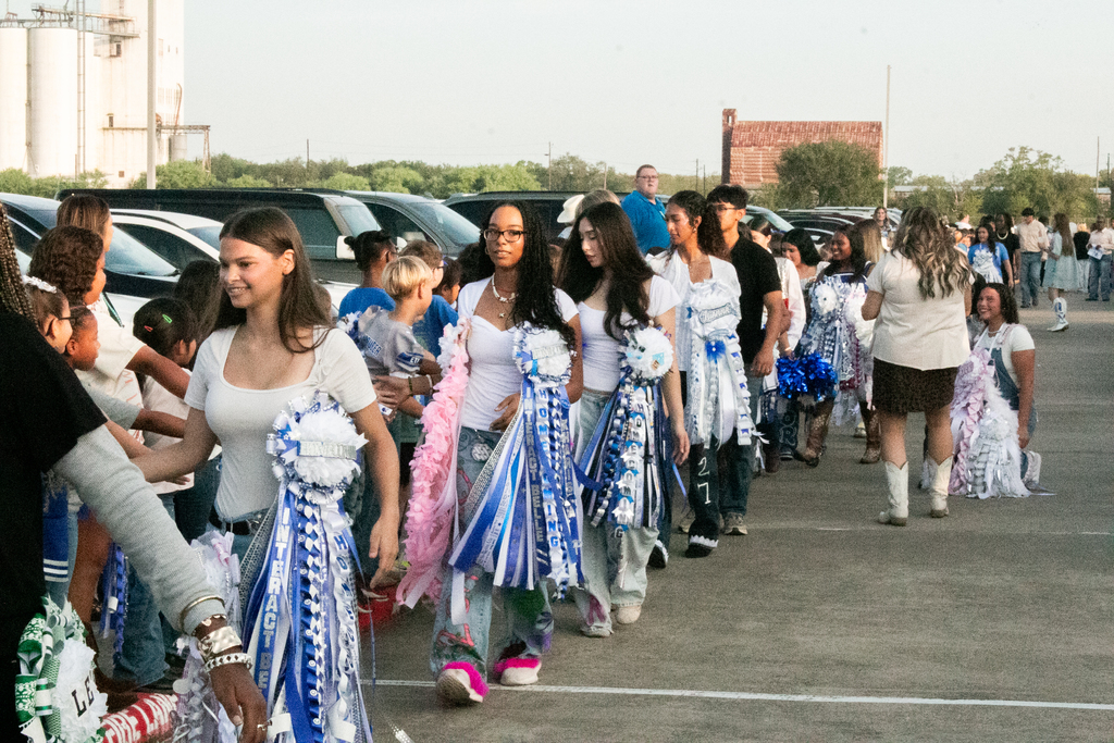 💙🤠 **LOOK WHO STOPPED BY!** 🤠💙 This morning, the **Homecoming Parade** stopped by the Elementary School, and our seniors, football players, cheerleaders, and dance team got to spend some time with our littlest Wranglers! 🐴💙 There were plenty of smiles, handshakes, and Homecoming spirit all around! 🏈🎉