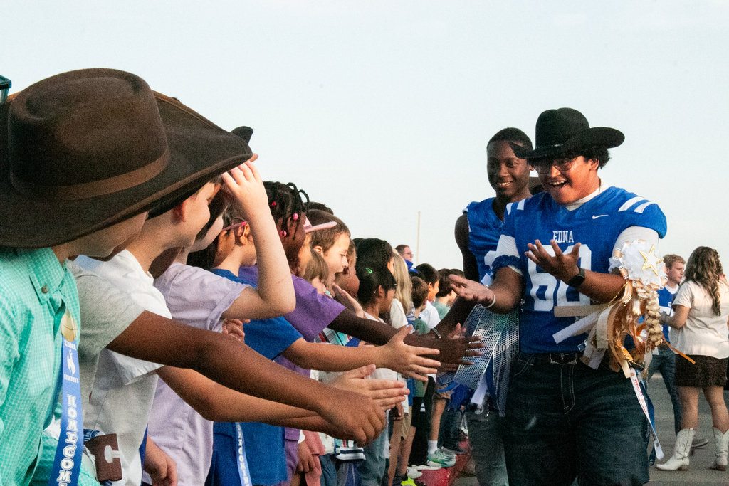 💙🤠 **LOOK WHO STOPPED BY!** 🤠💙 This morning, the **Homecoming Parade** stopped by the Elementary School, and our seniors, football players, cheerleaders, and dance team got to spend some time with our littlest Wranglers! 🐴💙 There were plenty of smiles, handshakes, and Homecoming spirit all around! 🏈🎉