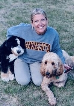 person with two dogs