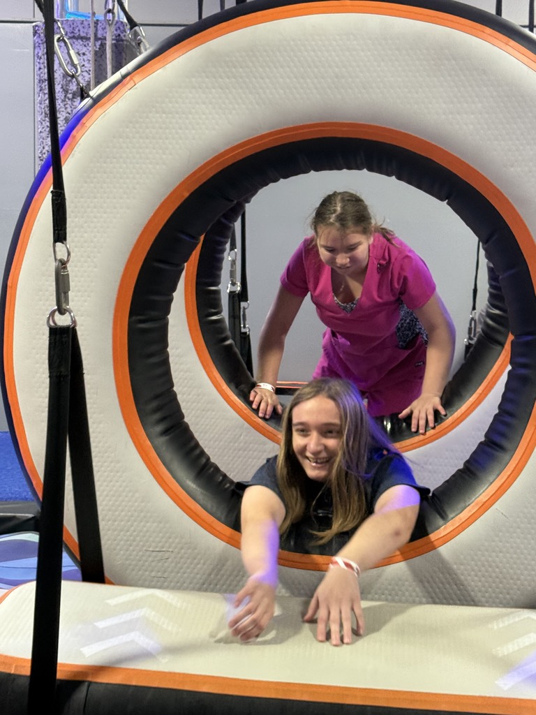two students going through two foam tunnels