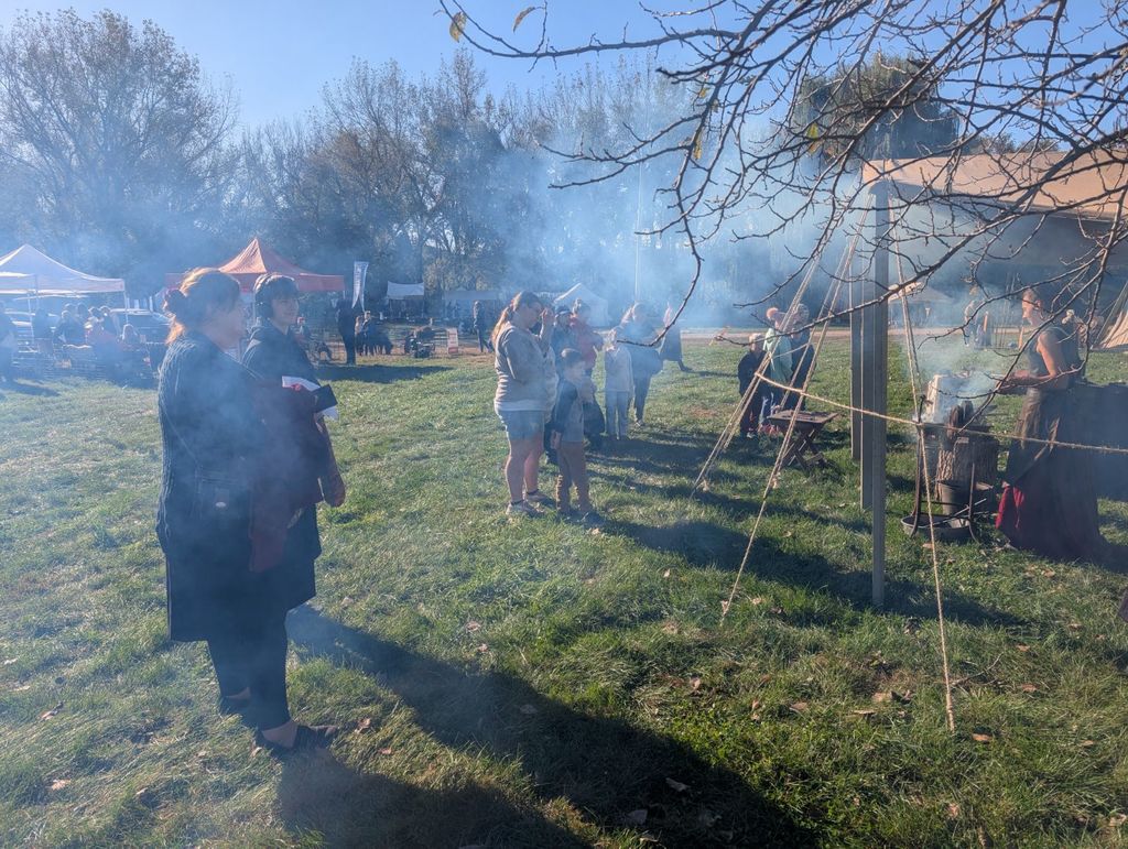 people watching a blacksmith demonstration