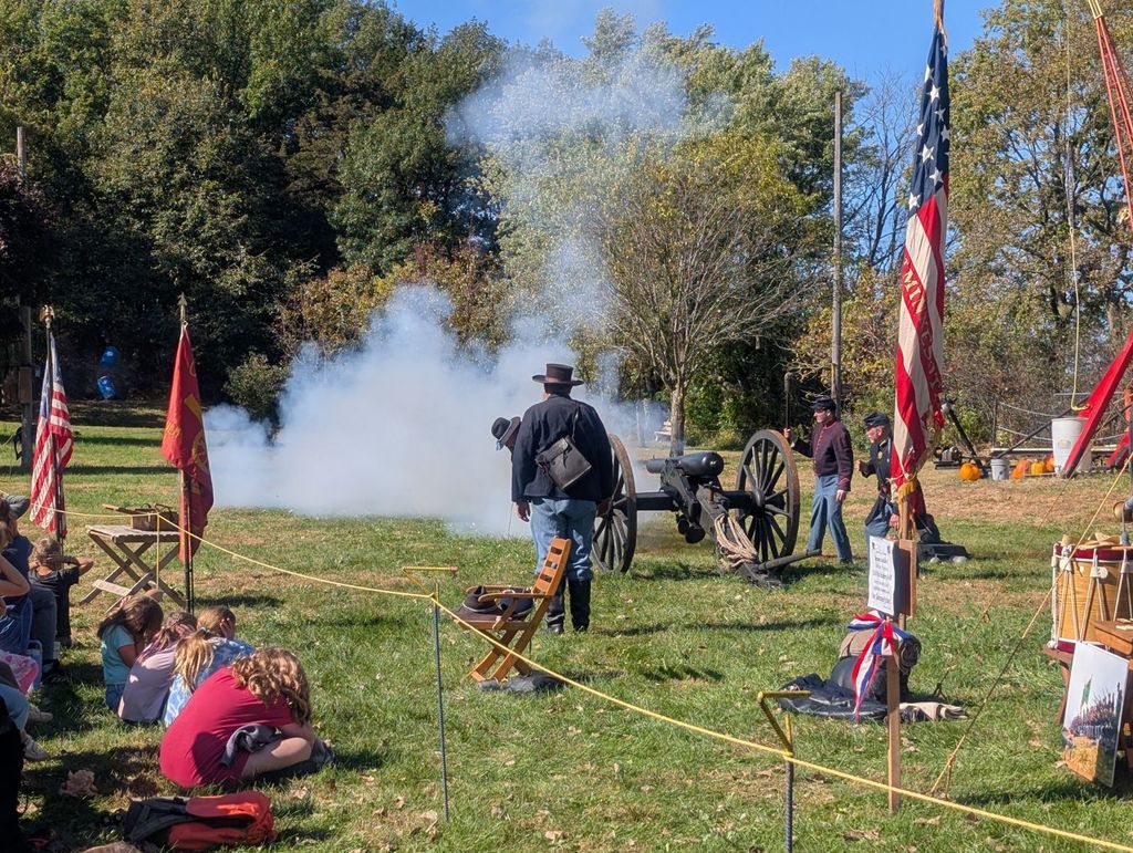 people watching canons being shot