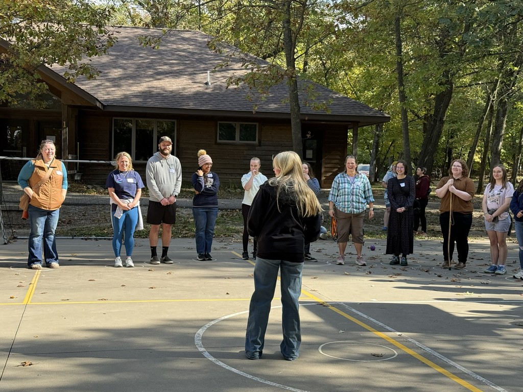 group of students on a basketball court playing a game