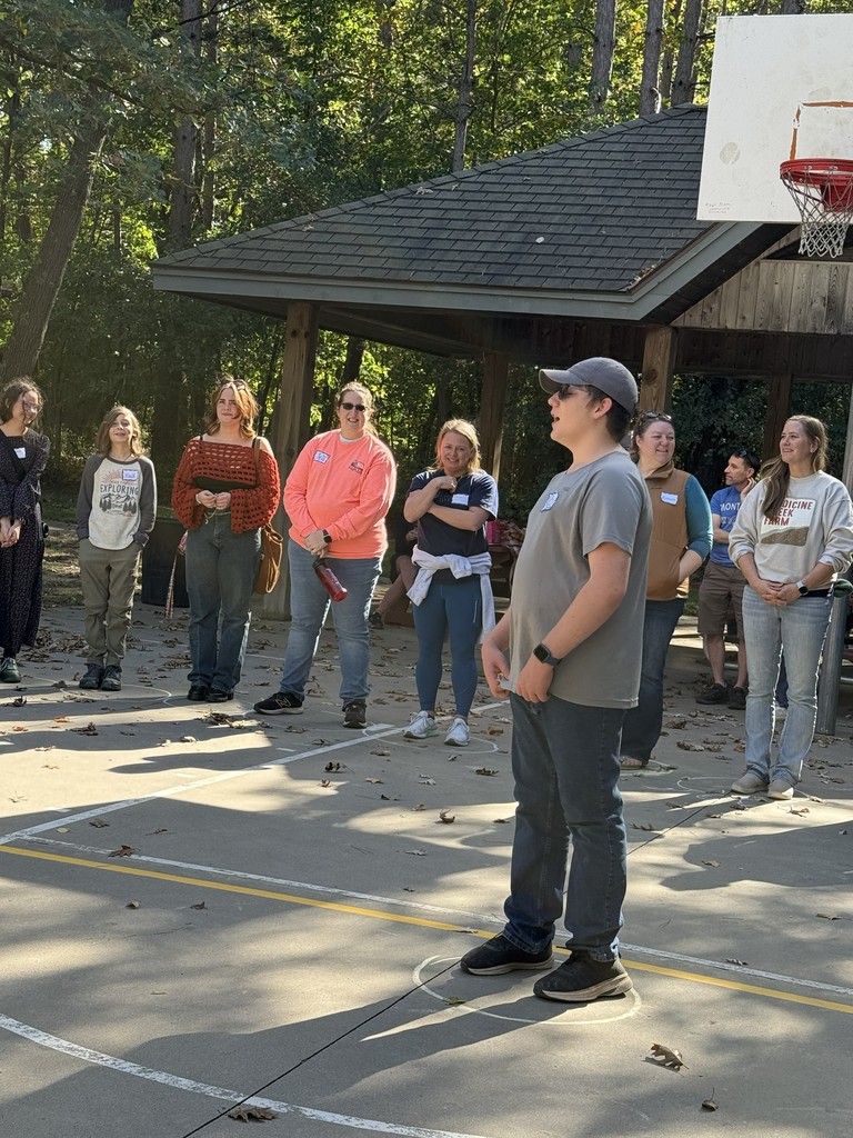 group of students on a basketball court playing a game