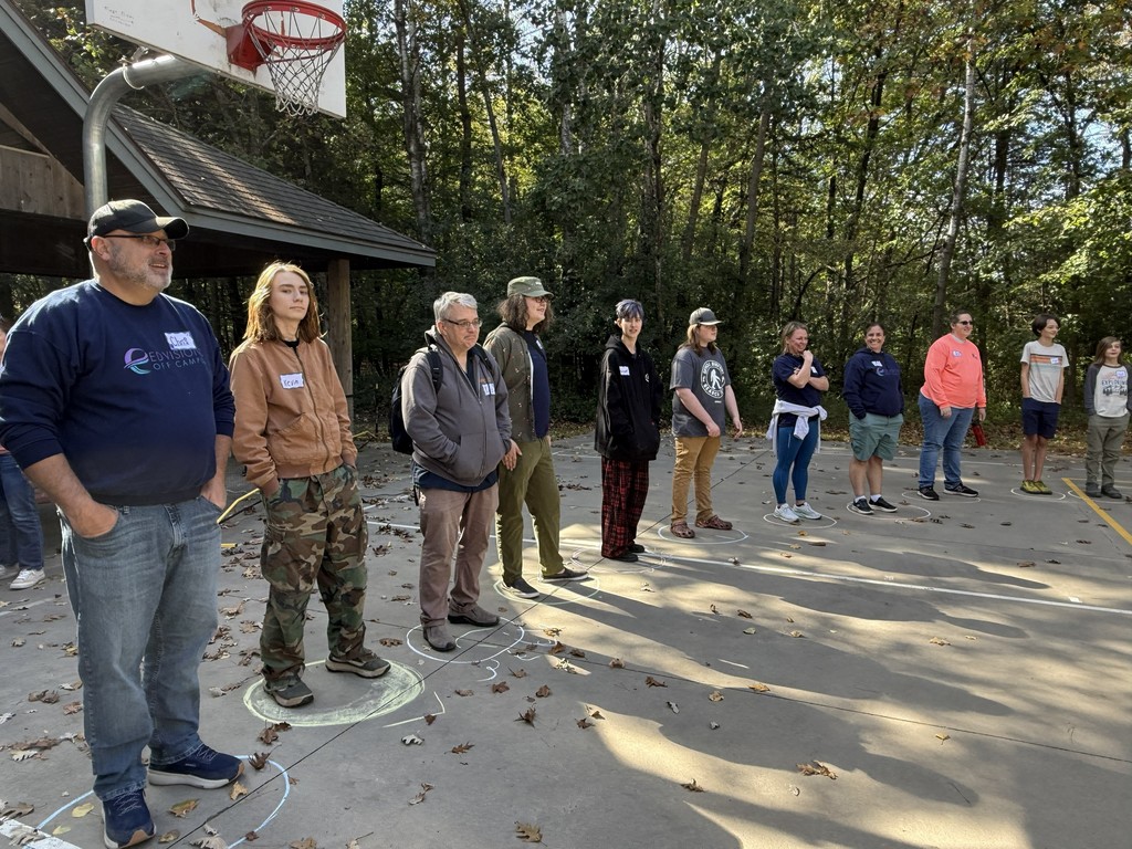 group of students on a basketball court playing a game