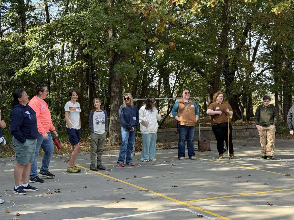 group of students on a basketball court playing a game