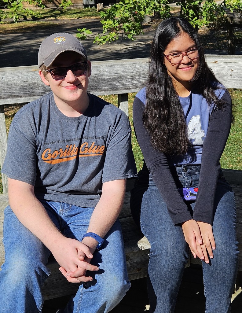 two students on a bench