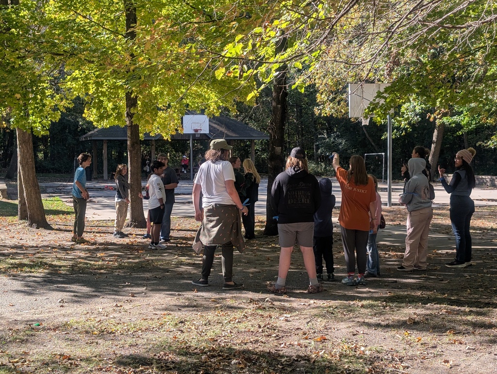 student playing by a basketball court