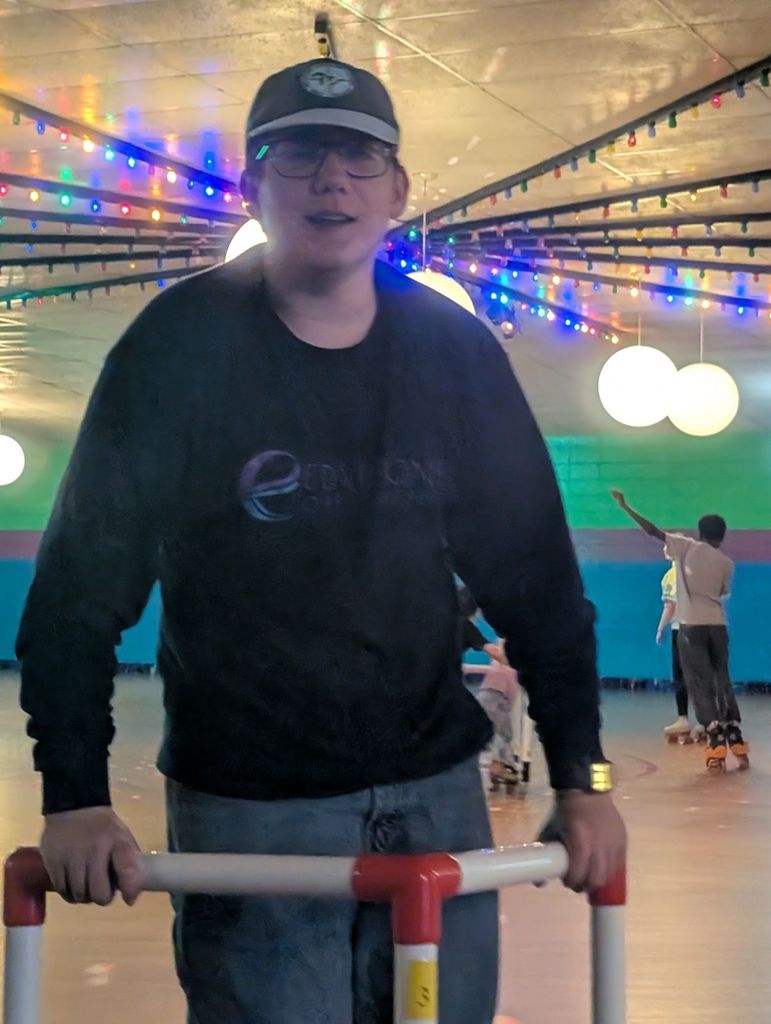 student wearing a hat roller skating