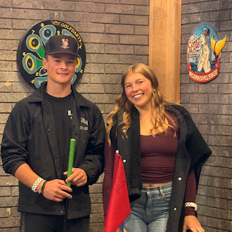 two students smiling for the camera