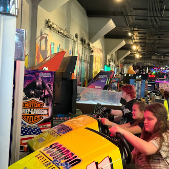 students playing racing video games