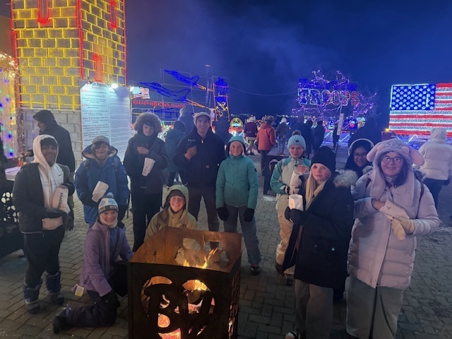 group of student around a campfire