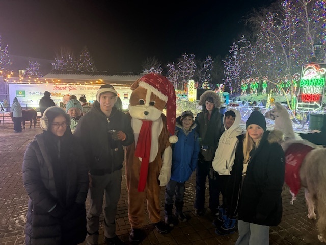 students with a llama and a person in a dog costume