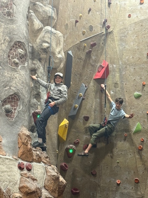 students rock climbing