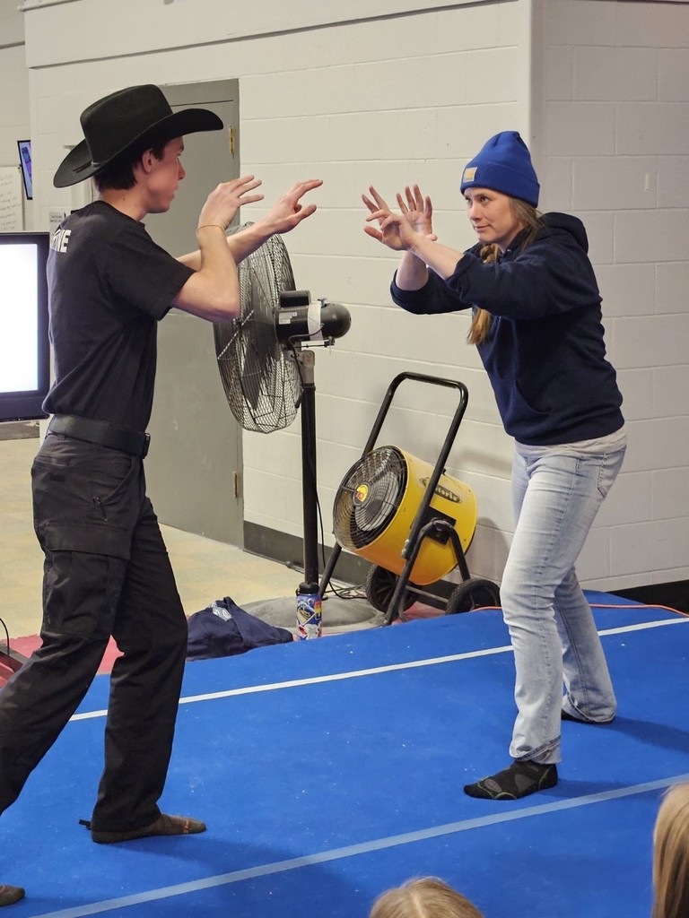 two people sparring on a mat