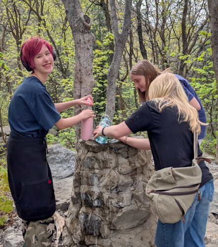 students by water fountain