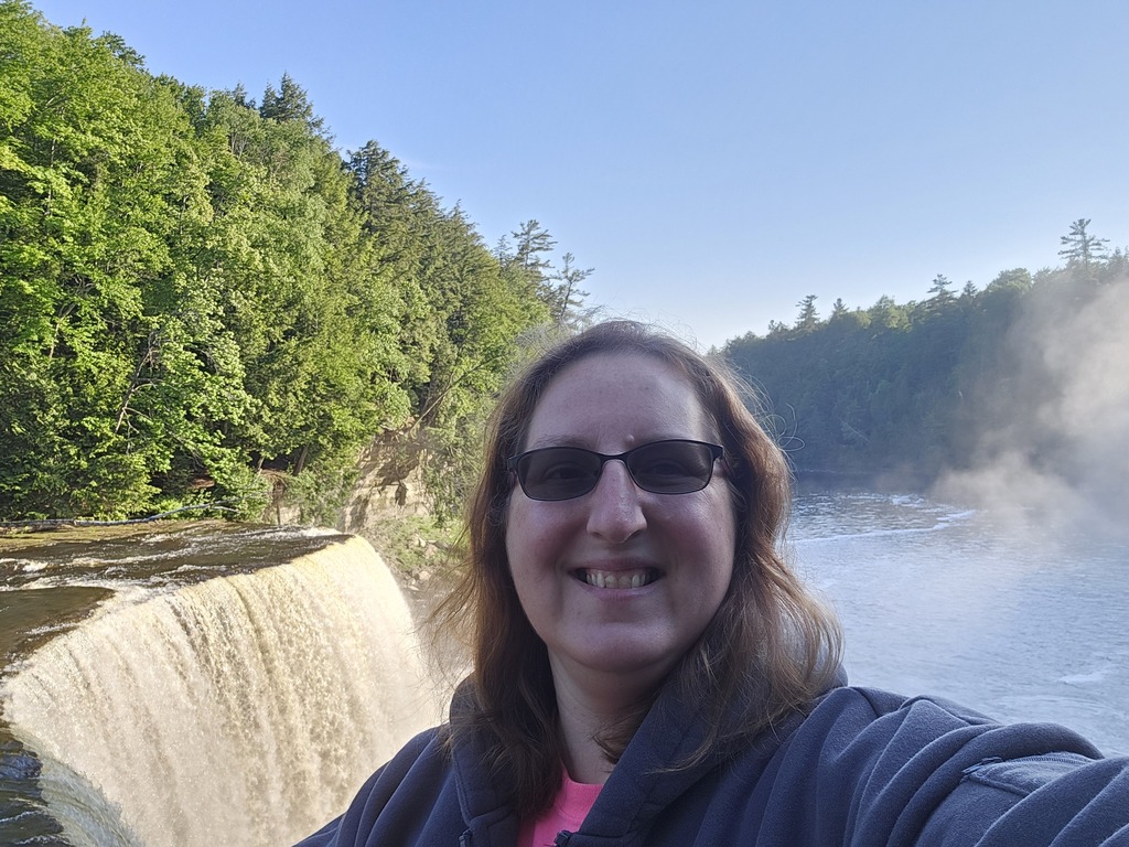 selfie in front of a waterfall