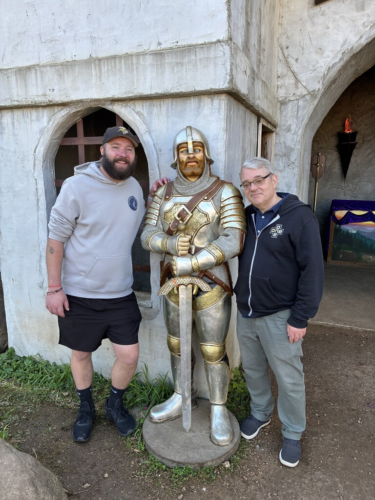 Two teachers with a knight in armor