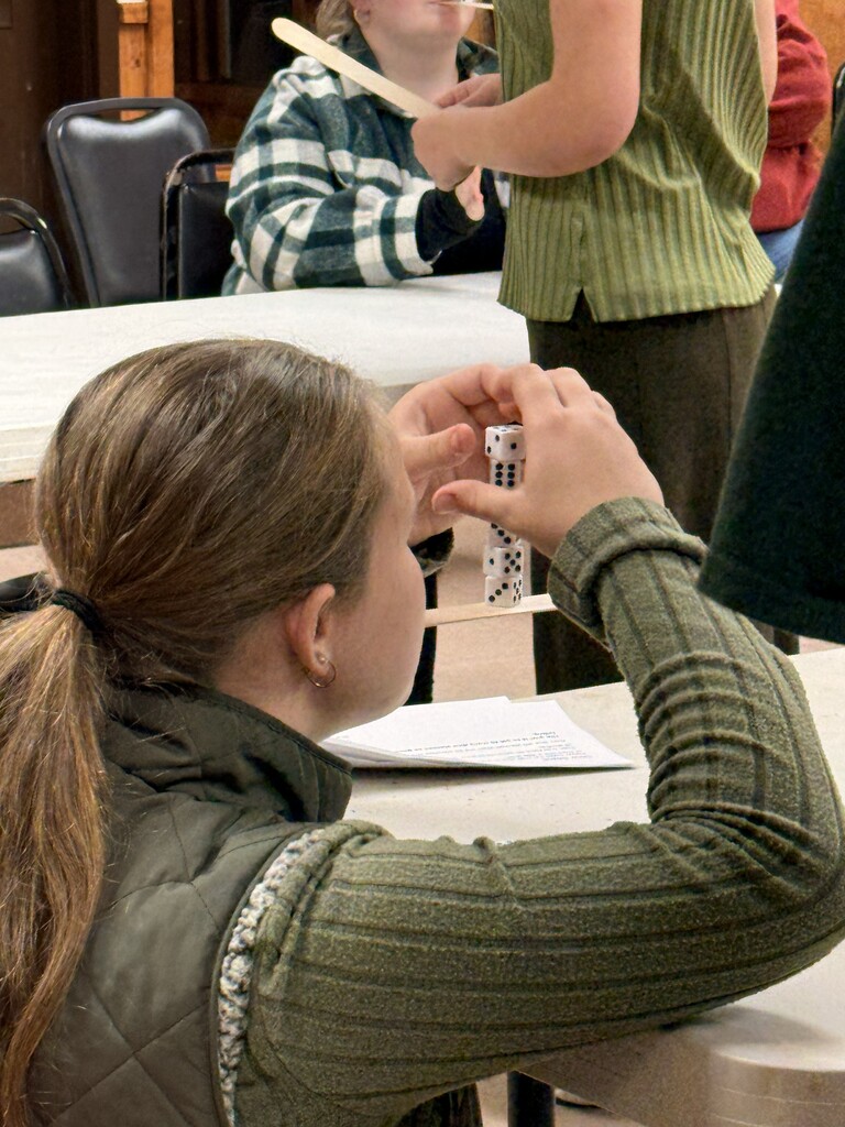 students stacking dice