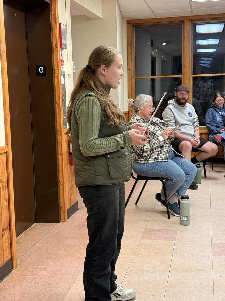 student explaining the drawing