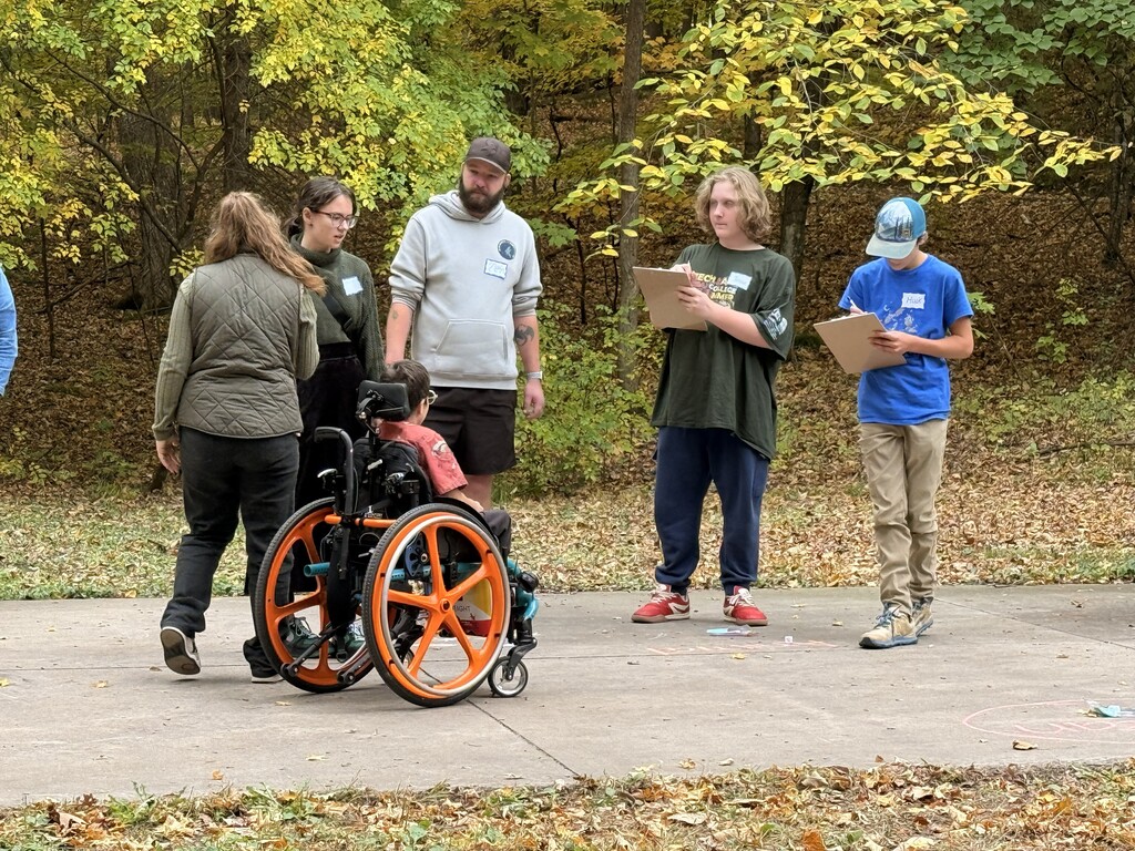 students working on activity together with clipboards