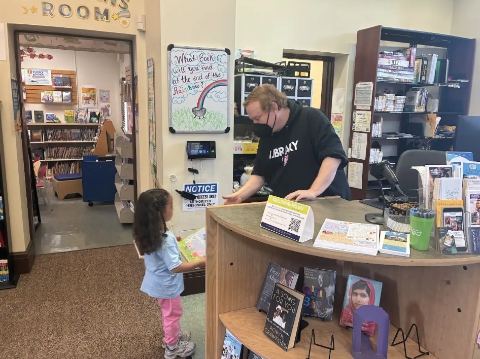 Kids returning library books