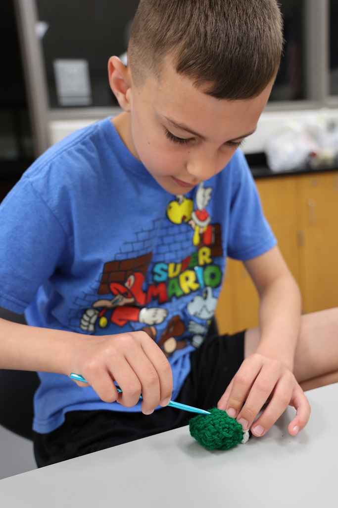 Boy crocheting