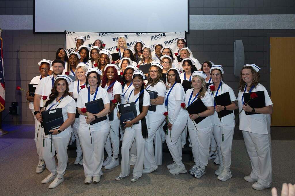 graduating students posing for a group photo