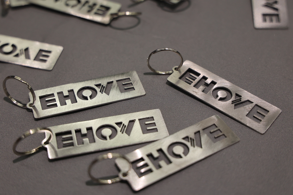 multiple laser cut tags that say EHOVE