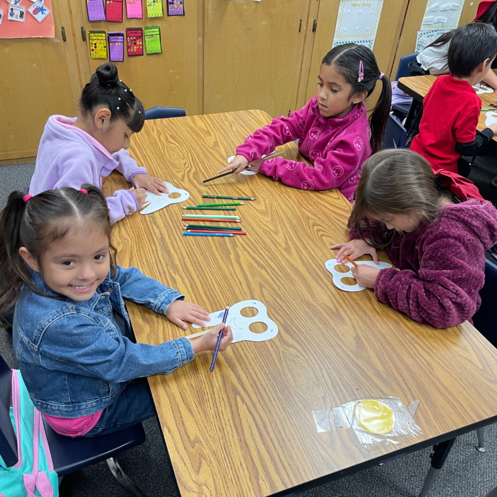 kids at table coloring their tooth