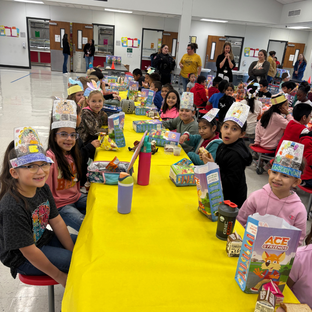kids at cafeteria table covered with a tablecloth