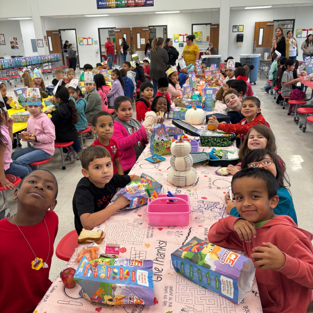 kids at cafeteria table working on activites
